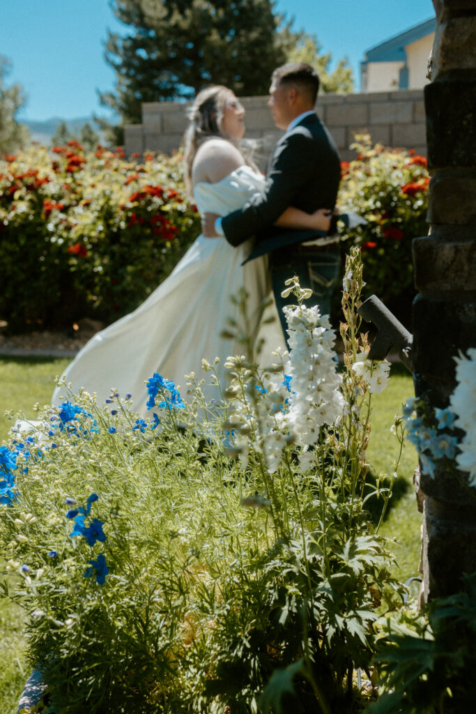 An intimate first look moment captured by a Tucson wedding photographer: The couple shares a tender embrace, soaking in the joy and love of seeing each other for the first time, framed by the breathtaking Arizona desert.